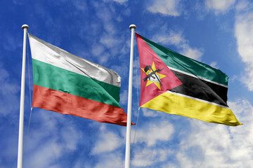 3D illustration. Bulgaria and Mozambique Flag waving in the sky. High detailed waving flag. 3D render. Waving in the sky. Flags fluttered in the cloudy sky.