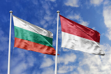 3D illustration. Bulgaria and Monaco Flag waving in the sky. High detailed waving flag. 3D render. Waving in the sky. Flags fluttered in the cloudy sky.