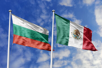 3D illustration. Bulgaria and Mexico Flag waving in the sky. High detailed waving flag. 3D render. Waving in the sky. Flags fluttered in the cloudy sky.