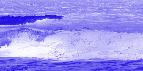 Beautiful blue natural sea background with blue water and white foam on sea waves near beach at resort close-up. beautiful sea in purple background,