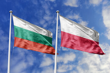 3D illustration. Bulgaria and Poland Flag waving in the sky. High detailed waving flag. 3D render. Waving in the sky. Flags fluttered in the cloudy sky.