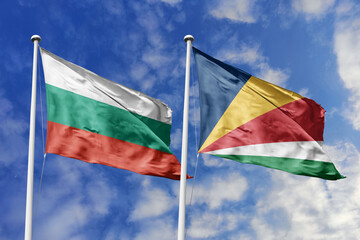3D illustration. Bulgaria and Seychelles Flag waving in the sky. High detailed waving flag. 3D render. Waving in the sky. Flags fluttered in the cloudy sky.