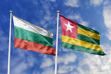 3D illustration. Bulgaria and Togo Flag waving in the sky. High detailed waving flag. 3D render. Waving in the sky. Flags fluttered in the cloudy sky.