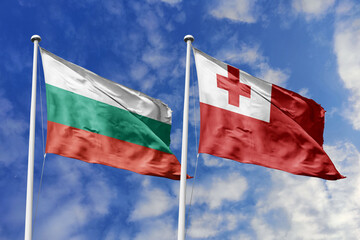 3D illustration. Bulgaria and Tonga Flag waving in the sky. High detailed waving flag. 3D render. Waving in the sky. Flags fluttered in the cloudy sky.