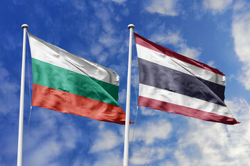 3D illustration. Bulgaria and Thailand Flag waving in the sky. High detailed waving flag. 3D render. Waving in the sky. Flags fluttered in the cloudy sky.