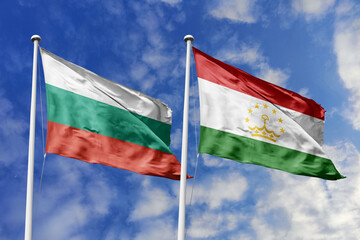 3D illustration. Bulgaria and Tajikistan Flag waving in the sky. High detailed waving flag. 3D render. Waving in the sky. Flags fluttered in the cloudy sky.