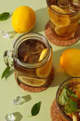 Cold tea with ice, mint leaves and orange slices