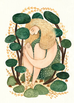 Girl sitting in the middle of plants and trees and enjoying the forest