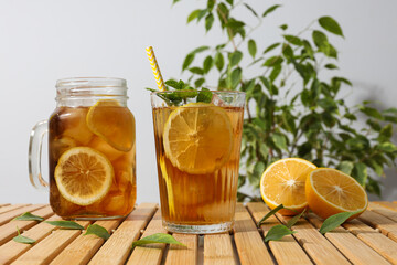 Cold tea with fresh oranges and mint leaves
