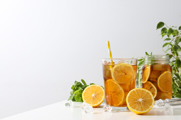 Cold tea with fresh oranges and mint leaves