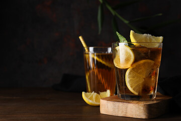 A glass of cold tea on a dark background