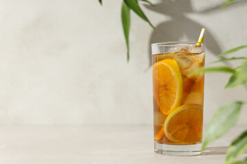 A glass of delicious cold tea on a white background