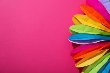 LGBT parade concept, holiday symbols on pink background.
