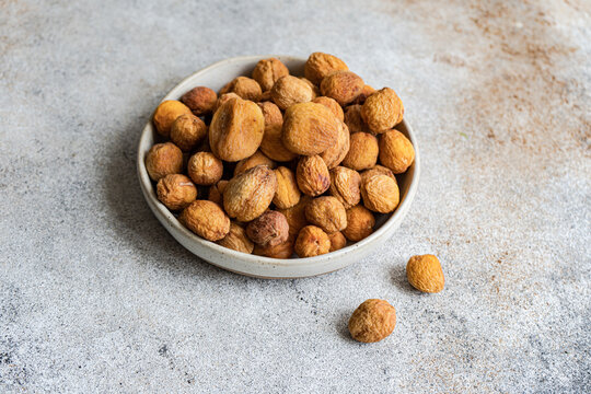 Sun-dried Arashan Kandak Wild Apricots in a Bowl