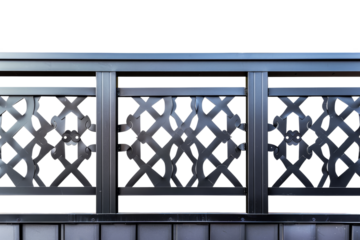 Close-up of intricate metal fence design with geometric patterns, showcasing detailed craftsmanship and modern architectural element.