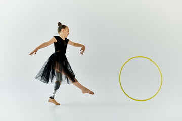 A young girl with a prosthetic leg performs a graceful gymnastics routine, showcasing her talent...