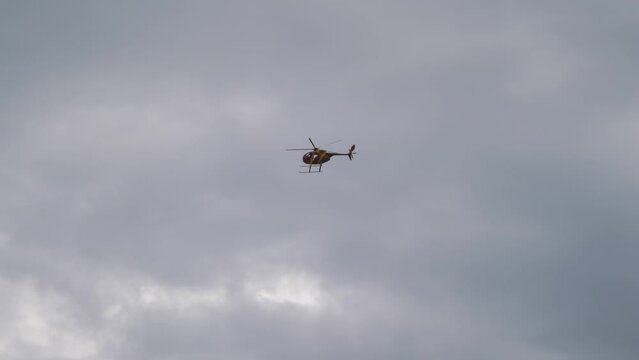 Helicopter Soaring in the Sky on a Bright Day in 4k slow motion 60fps