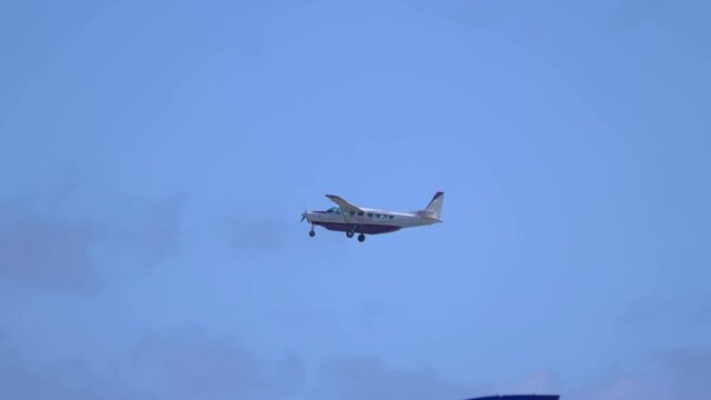 Small Airplane Gliding High in the Clear Blue Sky in 4k slow motion 60fps