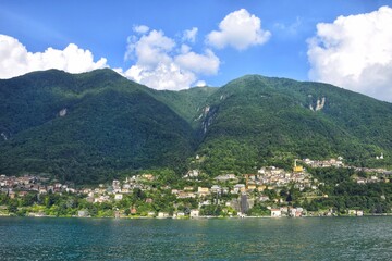 Obraz premium View of a typical village surrounded by Lake Como, Italy. Popular tourist destination.