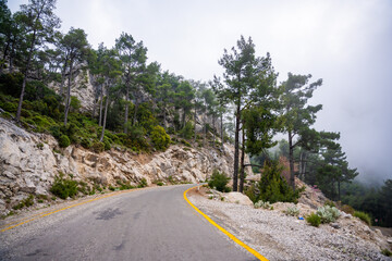 Road trip, view from car along to mountain roads and serpentines in mountain near Fethiye, Turkey