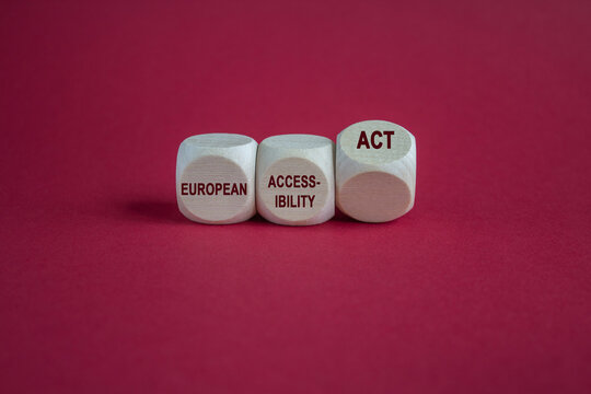 Cubes form the expression 'European Accessibility Act' as symbol for the new European law in 2025. Beautiful red background. Copy space.