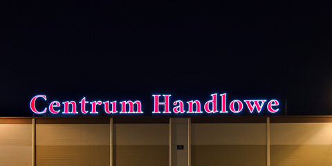 Neon Shopping Center Sign at night Neon in Polish