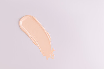 Liquid Sample powder swatch for face makeup. Universal tone. Light and delicate powder structure. Pastel background. A copy space. layout. mockup.