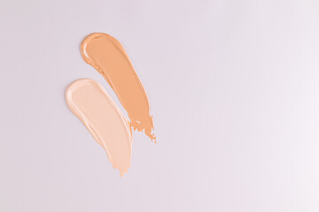 Two swatch Liquid Powder, Foundation of light and dark color cosmetic for makeup . Top view. white background. Layout for design.