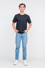Handsome young Asian man in casual black shirt and jeans