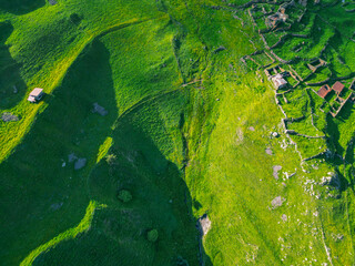  green grassy mountain landscape - aerial drone shot, background wallpaper