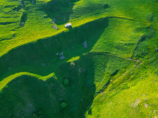 Green grassy mountain landscape - drone photo wallpaper background