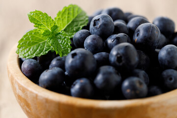 Ripe organic blueberries on wooden table background. Selective focus.