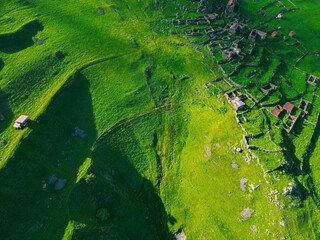  green grassy mountain landscape - aerial drone shot, background wallpaper