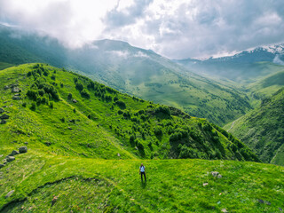 Fototapeta premium green grassy mountain landscape - aerial drone shot, background wallpaper