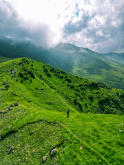 Green grassy mountain landscape - drone photo wallpaper background