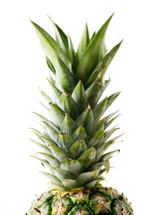 Ripe organic pineapple on white table background.