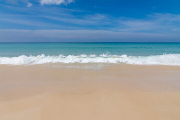 Fototapeta premium Beautiful wave on the beach, clear water, white sand in your holiday at andaman sea Phuket Thailand.