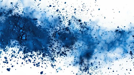 Obraz premium A dynamic explosion of blue powder against a white background, creating a striking visual effect with scattered particles of various sizes. The vibrant blue hue contrasts sharply with the stark white.