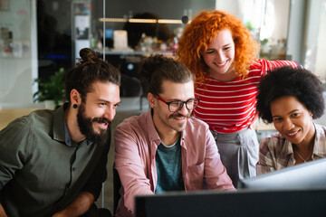 Group of business people and software developers working as a team in office