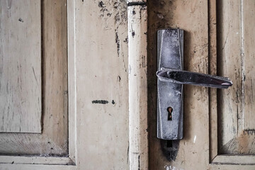 Close up photo of The keyhole of an old locked door. Concept for security and privacy.