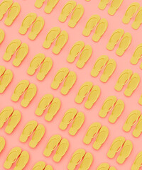 Repetitive flat lay of rows of flip flops on a vibrant pink background concept 3d render