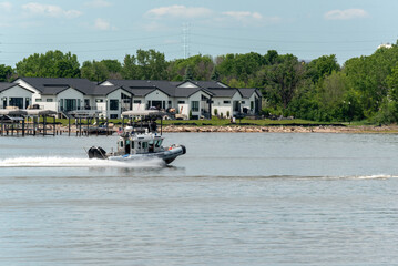 Police Boat Traveling At High Speed On The River In Wisconsin