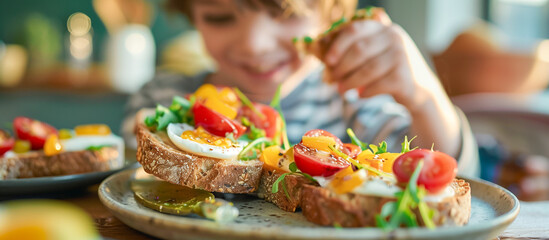 kid eating Delicious breakfast toasts with fresh healthy ingredients