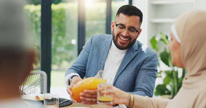 Smile, juice and muslim family in home for breakfast, bonding and healthy dish together. Happy, love and islamic man pour nutrition fruit drink for wife at morning meal in dining room at house. - Powered by Adobe