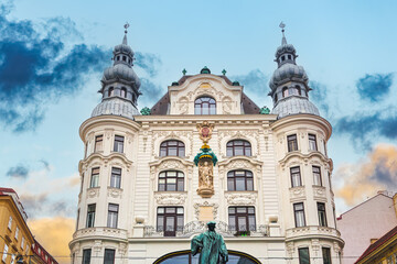 1897 Regensburger Hof building at Lugeck square with a statue of Johannes Gutenberg, Vienna, Austria