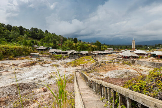 Steaming volcanic fumarole field, shops and cafes at Bukit Kasih, a tourist park with a peace tower and worship houses of five major religions, Bukit Kasih, Minahasa, North Sulawesi, Indonesia