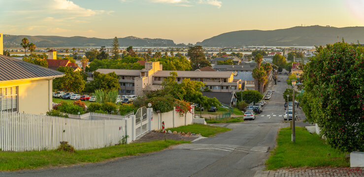 View of suburb street overlooking Knysna at sunset, Knysna, Garden Route, Western Cape