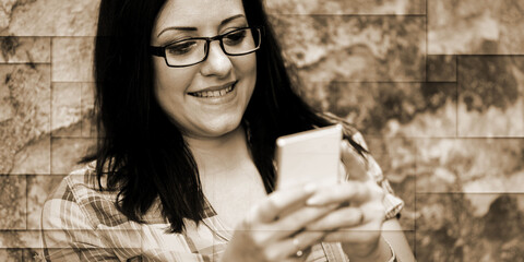 Portrait of beautiful young woman using phone, geometric pattern