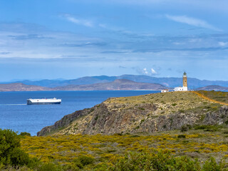Amazing lighthouse of Moudari with ruins of flag signs building on Kythira island, Greece.