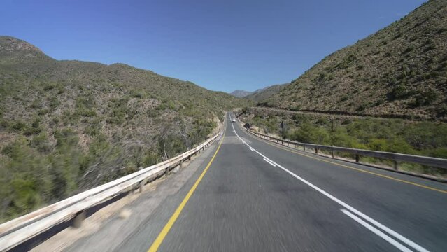 On the road view of road R62 and green mountainous landscape between Zoar and Calitzdorp, Western Cape Province, South Africa, Africa